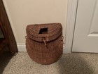 Charming Vintage Wicker Basket Features A Curved Woven Body