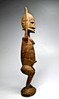 A Dogon Female Praying For Rain Sculpture