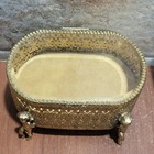 Vintage Gold Filigree Ormolu Beveled Glass Oval Jewelry Box Cherub Cupid Feet