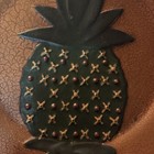 This Decorative Wall Plate Features Stylized  Green Pineapple Motif