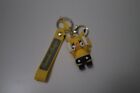 Carmela Indigo   Yellow Kaws Pikachu Keychain  new 