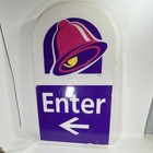 Taco Bell Logo  enter  Left Arrow Advertising Sign Purple White Pink Yellow