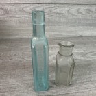 Vintage Lot Of 2 Bottles Wyeth Clear Medicine Bottle   Chamberlain Liniment Aqua