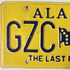 Alaska License Plate     free         Gzc 567   The Last Frontier Ak Embossed Flag Tag