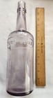 Early Embossed Whiskey     The Cyrus Nobel Co  Blown In Mold Sun Colored Amethyst