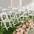 White Resin Folding Chair With Cushion Backrest 700lb Capacity Indoor Outdoor