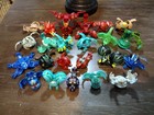 Bakugan Battle Brawlers Lot Of 24 With Carrying Case  Cards    Launchers 