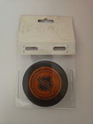 Official Nhl New Jersey Devils Orange Back Trench Hockey Puck
