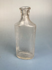 Antique Glass Medicine Bottle With Embossed Measuring Graduations