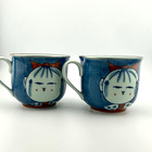 Asian Ceramic Mugs Pair Smiling Girl Face Blue Red Bow Impressed Maker Mark