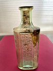 Pain Cure-red Flag Oil- E  Schmidt   Co  Baltimore   Green Transparent Bottle