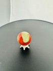 Akro Agate Oxblood And Lime Corkscrew Shooter Marble -  90    - 29 32   