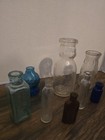 A Lot Of 8 Vint Glass Bottles Different Sizes And Shapes From Different Things