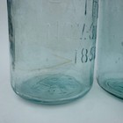 2 Different Color character Cross Mason Quart Jars  1 W  Large Bubble  1 Amber
