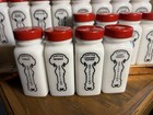 Set Of 16 Vintage Griffith   s White Milk Glass Bottles   Red Metal Lids  Rack