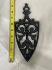 Vintage Trivet J z h  Cathedral T-12 Cast Iron Footed 1955  9  X 4 