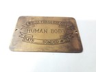 Antique Transport Id Tag  wells Fargo Exp  Co  Human Body  Brass Shipping Label