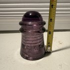 Purple Glass Insulator Embossed  w c m  Co   Approx  3 In Tall