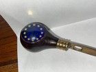 Vintage Metal Letter Opener With Wooden Knob And And Blue Background With Stars