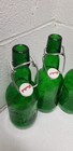 Four Grolsch Beer Bottles Green Embossed Glass Porcelain Swing Top