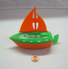 Plastic Orange green String Pull   Go Propelled Sail Boat 6 Inches Long