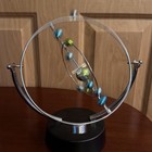 Kinetic Perpetual Motion Galaxy Desk Toy  Outer Space Gadget Flips   Rotates guc