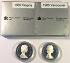 1982 Regina   1986 Vancouver  2  Royal Canadian Mint Proof Silver Dollars In Ogp
