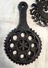 Lot Of 2 Small Cast Iron Trivets Grape 4 25   And Circular 5    1 Metal Rooster