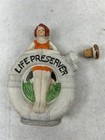 Antique Flask Liquor  nip 1920 Figural  Girl In Bathing Suit   life Preserver 