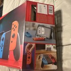   new   Nintendo Switch Home Console With Neon Blue And Red Joy-con Controllers