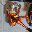 Pair Of Freshwater Fishing Reels And Bait Bag Of Rubber Worms