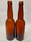 Pair Of Vintage Embossed Amber Schlitz Beer Bottles - 9 5  Crown Top