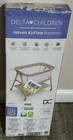 Delta Children Haven Airflow Bassinet Breathable Mesh Wheels Shelf Beige white