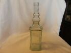 Vintage Clear Glass Bottle With Embossed Designs 11 75  Tall
