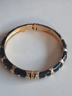 Vintage Gold-plated Hinged Bangle With Black Enamel Accents