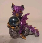 Small Purple Dragon Holding A Sphere 