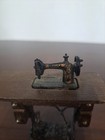 Vintage Miniature Singer Sewing Machine On Wooden Table With Moving Treadle   