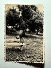 1950s Vintage Photo Young Man Doing Handstand Outdoors On Wooden Bench