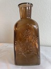 Brown Glass Decorative Bottle With Embossed Floral Flowers Design