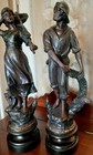 An Antique Pair Of Bronzed Spelter Figures Of A Fisherman And Woman 