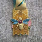 The Conqueror Virtual Challenge Conquer 2023 Annual Medal Flower Bee Clara Nietz
