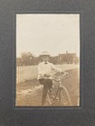 Boy W  Bicycle Hat Bowtie Outdoors House Fence Candid Antique Photo Early 1900s