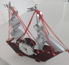 Wood Ship  With An Electric Clock Shaped Like A Ships Helm 
