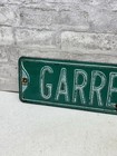 Vintage Embossed Steel Garrett St Street Sign Green White Metal Road Americana