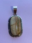 Navajo Dave Skeets Handmade Sterling Silver And Ribbon Turquoise Pendant