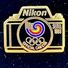 Mint Olympic Nikon Official Camera Of The 1988 Seoul Olympics Lapel Strap Pin