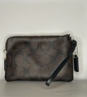 Coach Women s Corner Zip Wristlet In Signature Canvas  Brown black Used