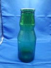 Vintage Green Glass Bottle With Textured ribbed Pattern Around Top   Bottom 