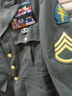 United States Vintage Military Attire With Patches And Pins