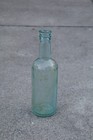 Antique Aqua Medicine Bottle     Embossed Glass     Early 1900s     Apothecary Decor